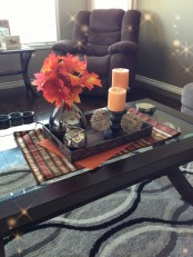fall leaves, colored candles and an owl figurine are all you need for fall home decor