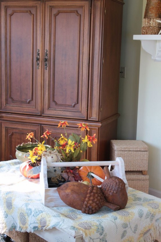 large faux acorns, pumpkins, bright fall florals in the pot are amazing and easy for fall decor