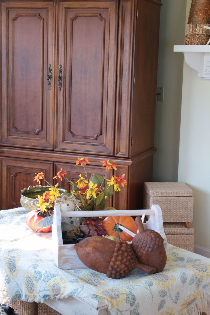 large faux acorns, pumpkins, bright fall florals in the pot are amazing and easy for fall decor