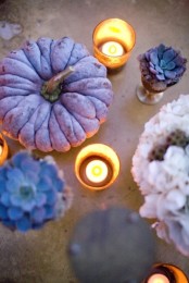 a purple pumpkin, purple succulents and candles in candleholders for chic and out of the box fall decor