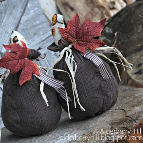 black fabric pumpkins with printed tops, striped ribbons and bold fall leaves look unusual and will fit Halloween, too