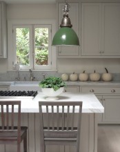 white pumpkins placed on your countertop will bring an elegant fall feel to your kitchen