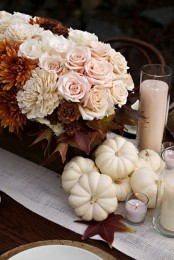 a rust, blush and white floral arrangement, white pumpkins and blush candles are fabulous and chic fall decorations