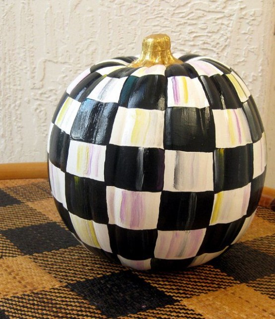 a plaid black and white pumpkin is a lovely monochromatic decoration with a traditional pattern