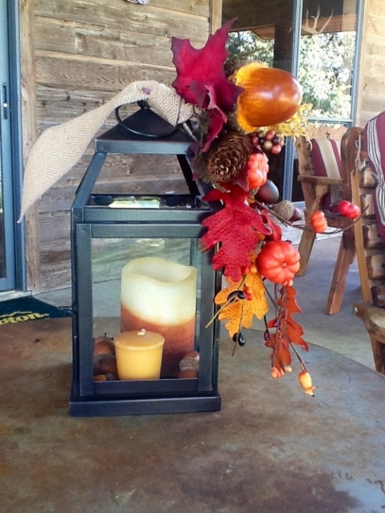 Faux leaves and pumpkins  would be better if you decide to use your fall lantern outdoors.