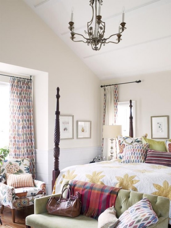 a bright farmhouse bedroom done in neutrals and spruced up with bright and printed textiles 