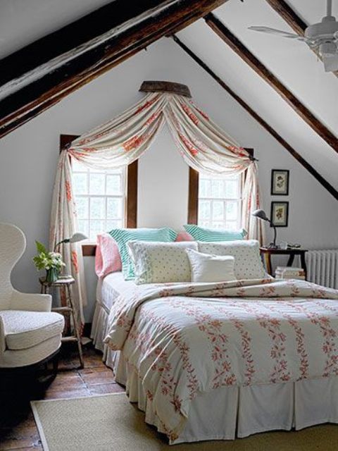 a vintage farmhouse bedroom with dark stained wooden beams, printed textiles and a neutral base