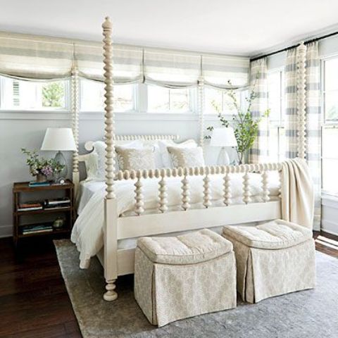 a farmhouse vintage bedroom in neutrals, with striped textiles and much natural light