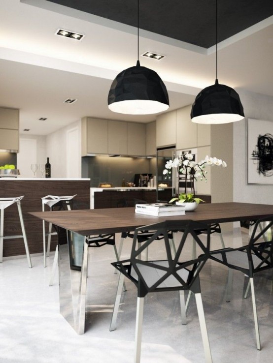 a stylish modern dining space with a dining table with polished metal legs, black geometric chairs, black pendant lamps