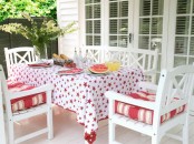 Festive Deck With Red And White Textiles