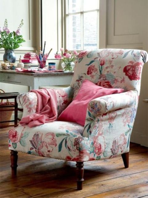 a vintage floral chair and pink blankets and pillows will add a soft vintage touch and elegance to your space