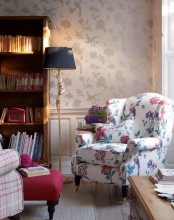 a white floral vintage chair with a matching pillow is a stylish and chic solution for any space, it will add a vintage feel to it