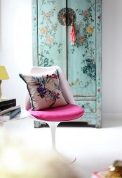a mint blue floral wardrobe and a floral pillow will add interest and chic to the space making it more colorful