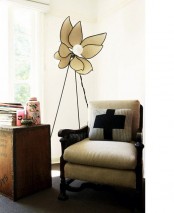 a large flower-shaped floor lamp will bring an unusual feel to your space and will make it look cool