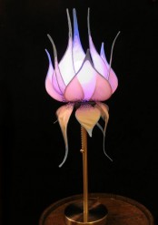 a table lamp with a pink flower-shaped lampshade is a creative and bold touch to your interior
