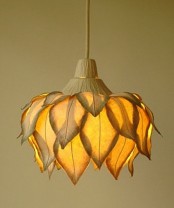 a marigold flower-shaped pendant lamp is a cool addition for a chic space and it will bring a natural touch to the space
