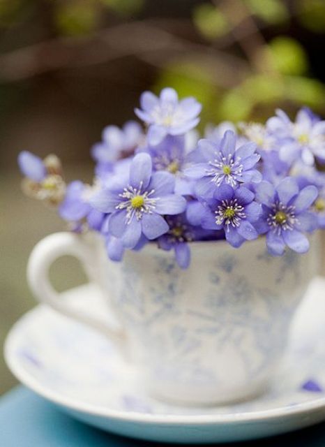 a vintage floral teacup with bold purple blooms is a pretty idea to add a spring feel to a vintage space