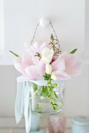 a clear jar with pink and white tulips can be used as an arrangement, centerpiece and even suspended somewhere like in this pic