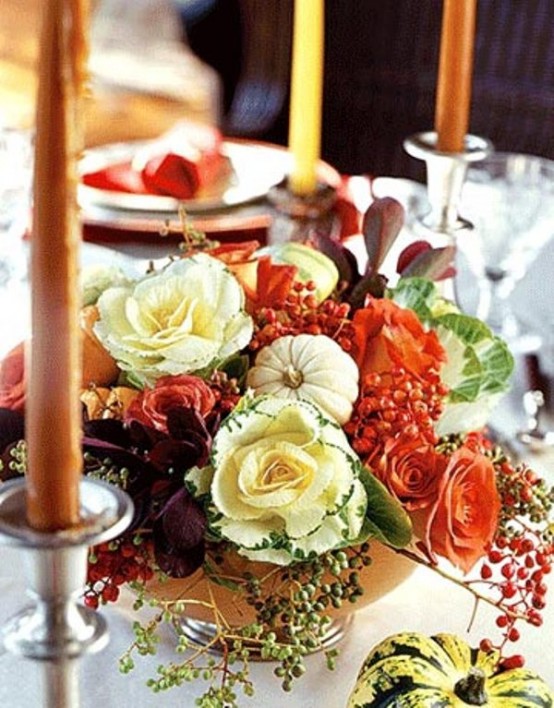 a bright Thanksgiving centerpiece of neutral and orange blooms, pumpkins, greenery, berries and dark foliage is a cool idea for Thanksgiving