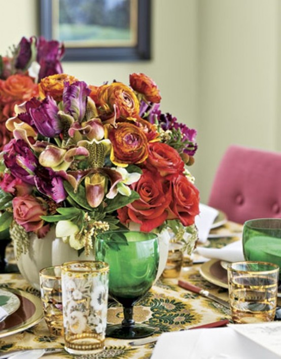 a bold Thanksgiving centerpiece of purple, orange and red blooms and greenery is a refined solution for a bright and exquisite party