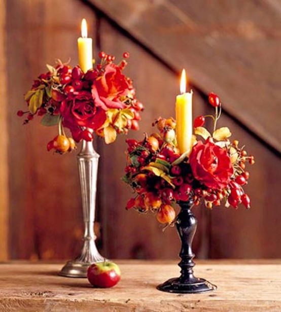 lovely and refined Thanksgiving or fall decor - vintage candleholders with candles, bold blooms and berries is a lovely idea