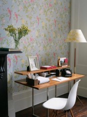 a bright botanical print wall, some blooms in a vase and some bright pink touches for a spring feel in the home office