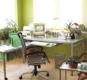 green walls, bright green folders and a mint green glass table refresh the look of the home office