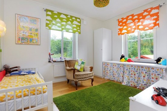 a colorful kid's room with a bed with bold mustard bedding, a green and an orange curtain, a green rug and an exquisite chair is amazing