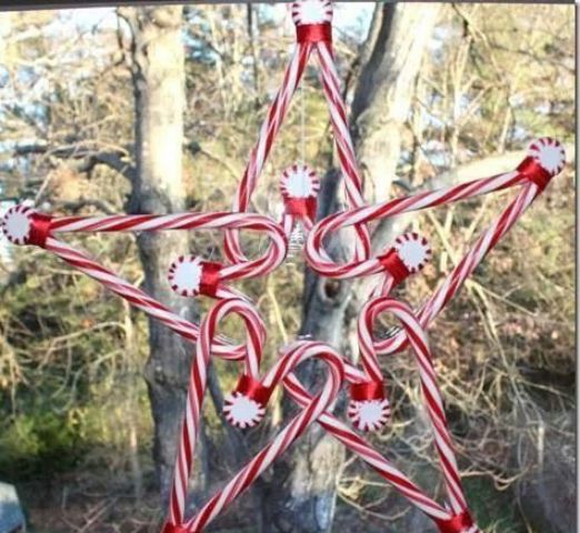 en edible Christmas decoration of candy canes and peppermints shaped as a star is a lovely idea for indoors and outdoors