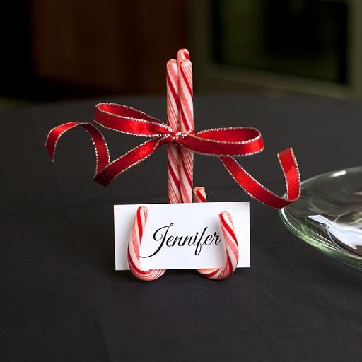 a candy cane stand with a red bow and a card is a pretty and cool decor idea for the holidays, make it yourself