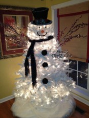 a white Christmas tree snowman with lights, a scarf, buttons, branches and a top hat is a lovely idea for a modern winter wedding