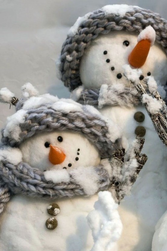 pretty cotton snowmen with branches and in cozy grey scarves and beanies look awesome and will be nice decor for both outdoors and indoors