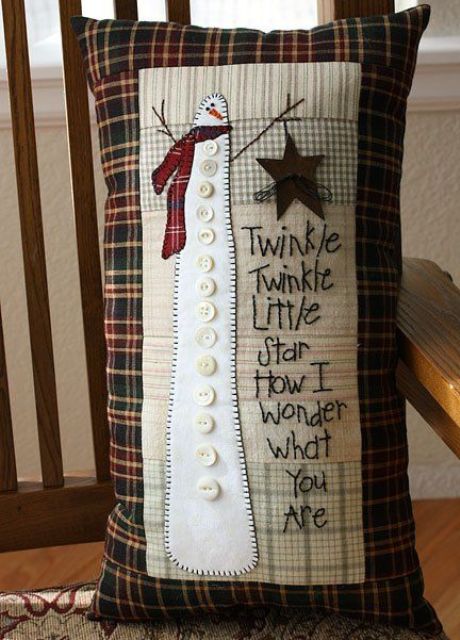 a red plaid pillow with a super tall snowman applique and some song lines is a cool idea for Christmas and for winter on the whole