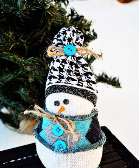 a pretty snowman decoration made of a sock, with a printed hat and a mini sweater with buttons is a lovely idea for Christmas