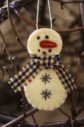 a felt snowman Christmas ornament with embroidery and a plaid scarf is a lovely idea that can be easily DIYed