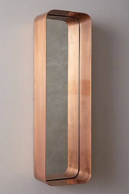 a quirky bathroom mirror, a narrow and tall one, in a wide copper frame that works as a shelf at the same time is a lovely idea for a modern bathroom