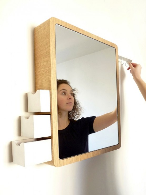 a creative modern mirror that features drawers and some hooks is a lovely and cool idea for a modenr bathroom, it will save you some space