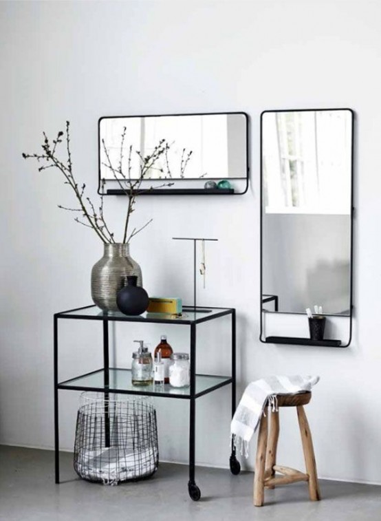 contemporary mirrors in black frames with little black shelves attached to the bottom are a veyr edgy and modern version of mirror storage cabinets
