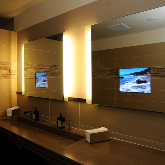 large lit up mirrors with built-in TV screens are a very cool solution if you love watching something and don't want to stop watching while being in the bathroom