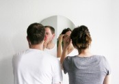 a round mirror split in two parts will allow you both using it, which is super precious when you are getting late in the morning