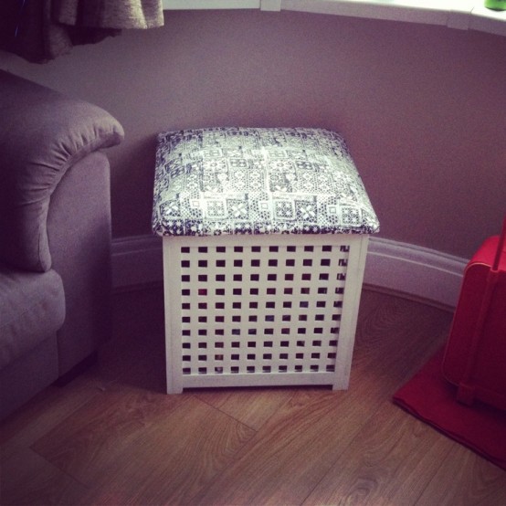 a small IKEA Hol table turned into an ottoman or stool with colorful upholstery and storage inside