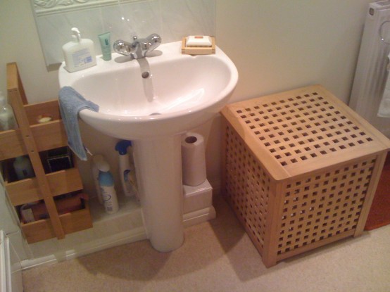 a small IKEA Hol table used in the bathroom to store things inside and outside too