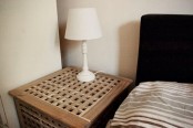a small IKEA Hol nightstand – use the space inside for storage and place a lamp on top