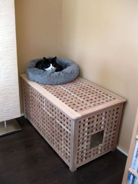 an IKEA Hol table with a kitty loo inside and a soft and fluffy bed on top is a very cool idea to rock