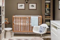 a gender-neutral nursery with taupe walls, white and neutral furniture, printed textiles and a skylight on the ceiling