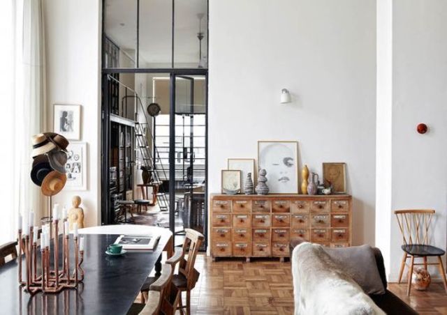 The natural wood medicine cabinet echoes the honey parquet floors