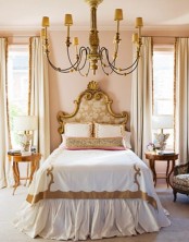 a refined neutral bedroom with classic chic and gold touches, exquisite furniture and lamps