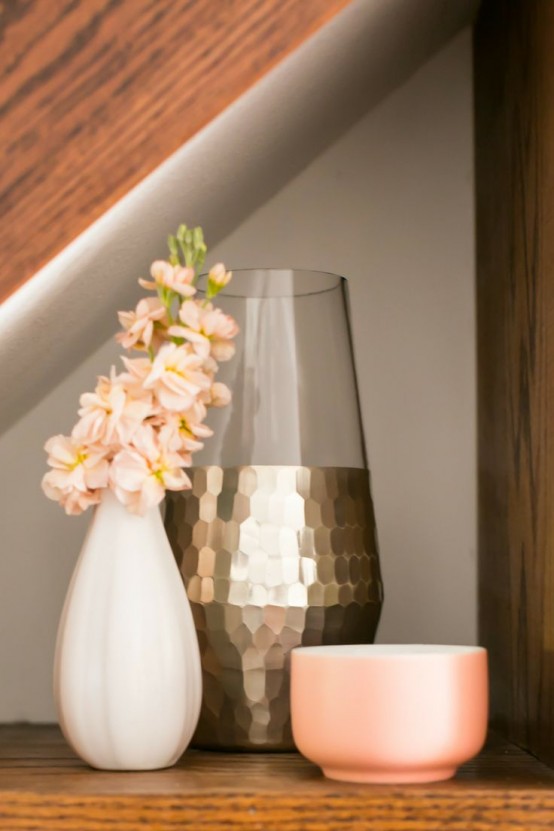 a gold vase with faceted decor is a lovely idea for glaming up the space and making it more eye-catchy