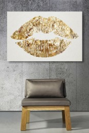 a super glam gold lip print is a cute and fun idea to add a playful touch to the space