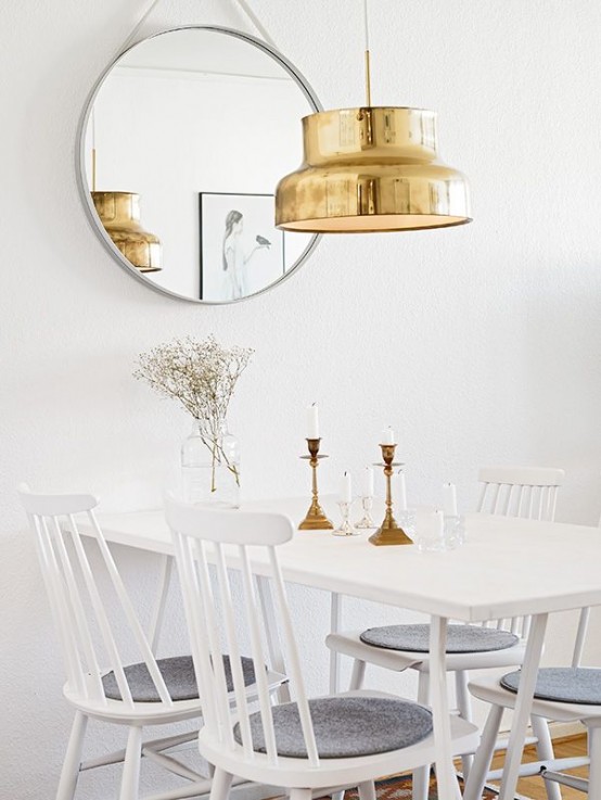 a large polished gold pendant lamp and gilded candlesticks will give your space a very refined and glam chic look